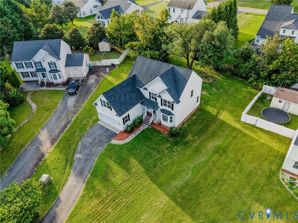 912 Harmony Road, Fairfield, VA 23059 Elegant Colonial-style residence set on expansive manicured grounds with mature landscaping