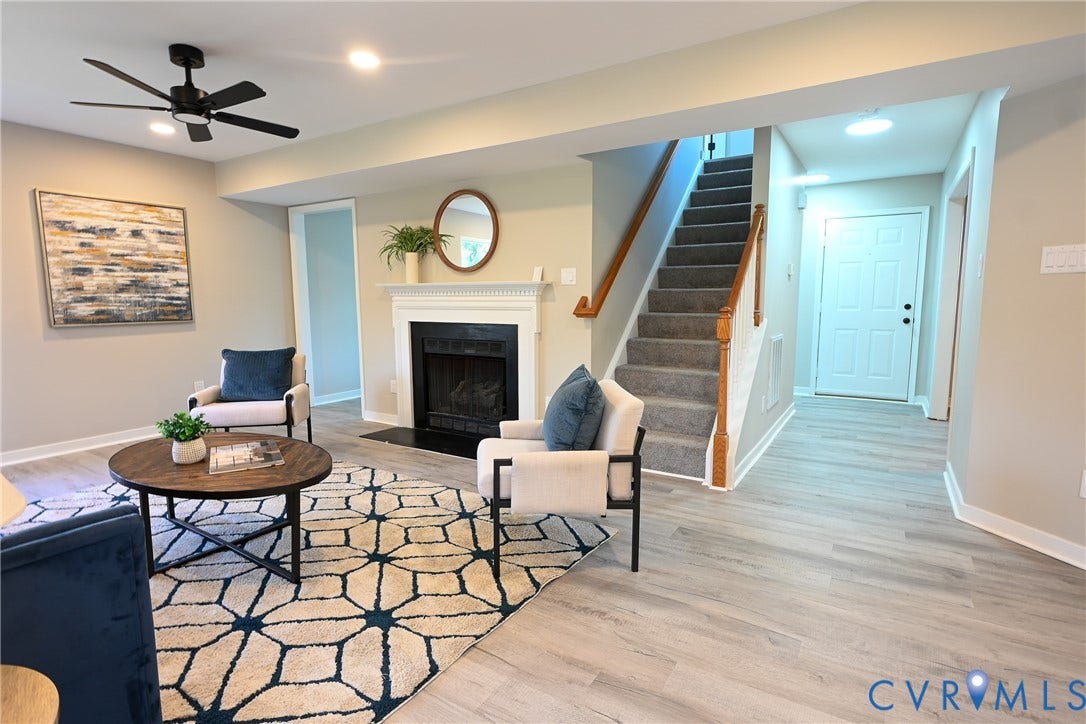 912 Harmony Road, Fairfield, VA 23059 Living space featuring a fireplace with a white mantel, wood-finish flooring, recessed lighting, and a ceiling fan