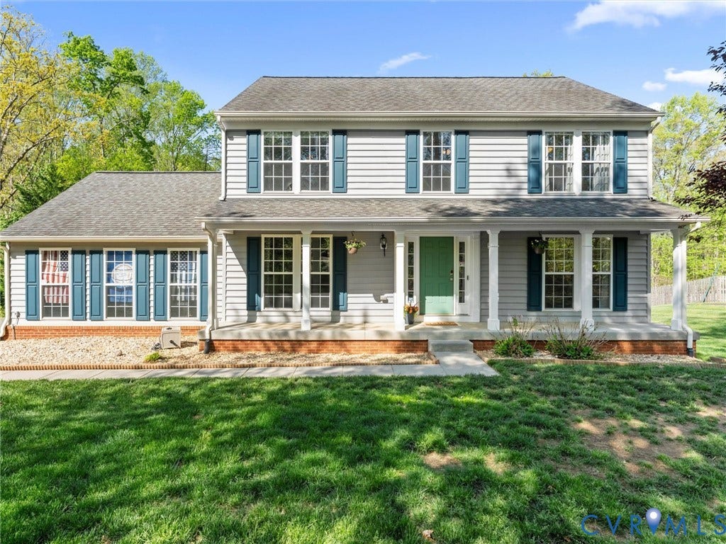 126 Reedy Creek Road, Reedy Creek, Louisa, VA 23093 The property features a two-story exterior with light gray siding and a dark gray shingled roof