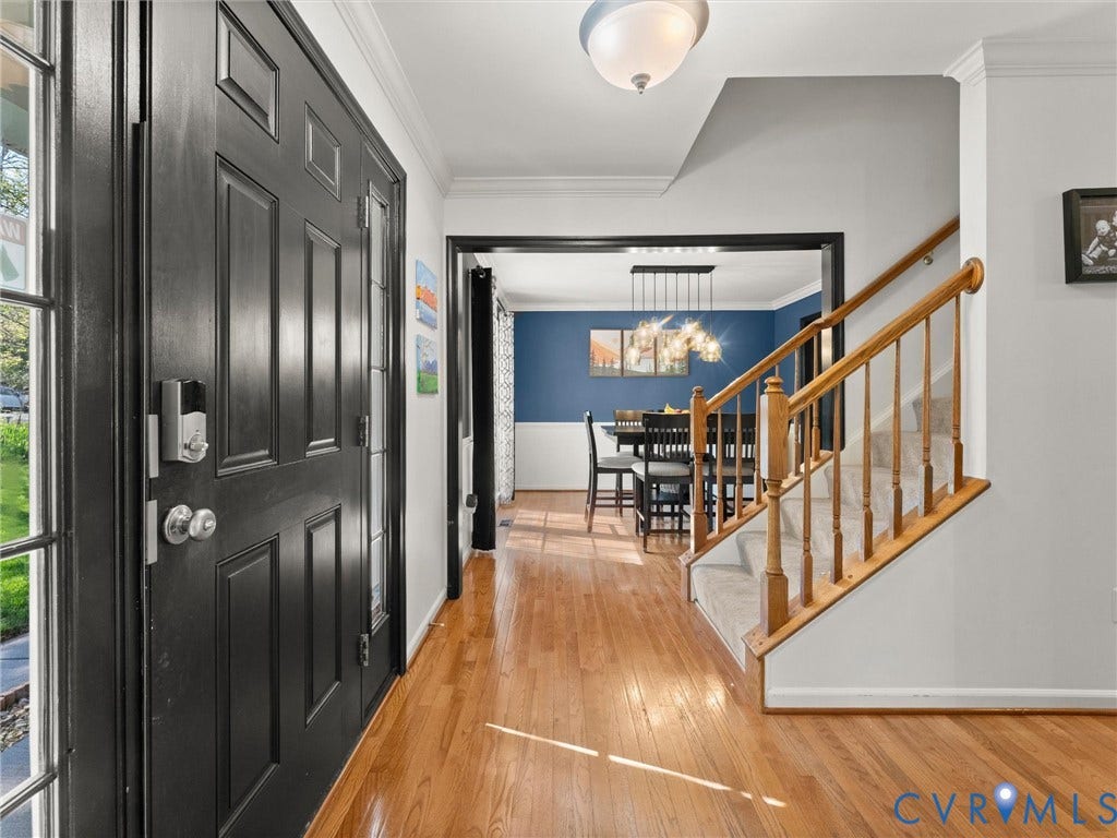 126 Reedy Creek Road, Reedy Creek, Louisa, VA 23093 The property features a front entry with a black paneled door and hardwood flooring