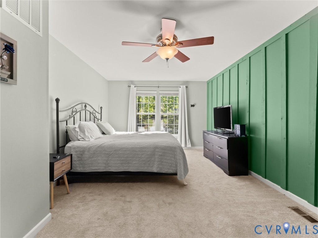 126 Reedy Creek Road, Reedy Creek, Louisa, VA 23093 The bedroom features carpeted flooring, a vaulted ceiling, and a ceiling fan with light fixture