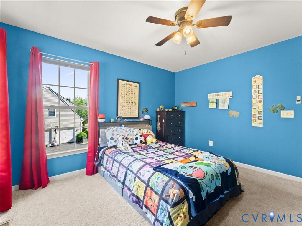 126 Reedy Creek Road, Reedy Creek, Louisa, VA 23093 This bedroom features a window providing natural light, a ceiling fan with integrated lighting, and carpeting