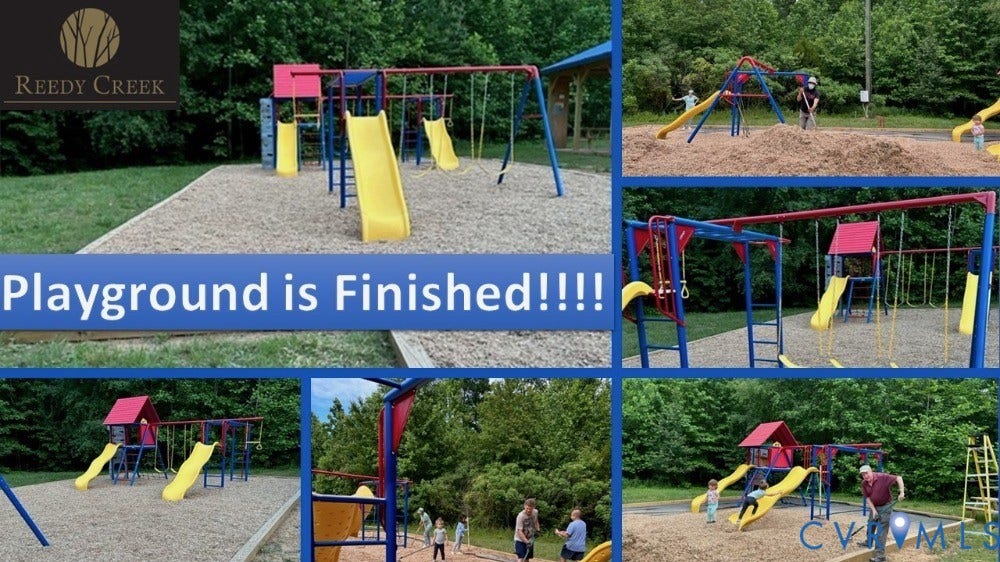 126 Reedy Creek Road, Reedy Creek, Louisa, VA 23093 Community playground featuring multiple slides, swings, climbing structures, and wood chip surfacing