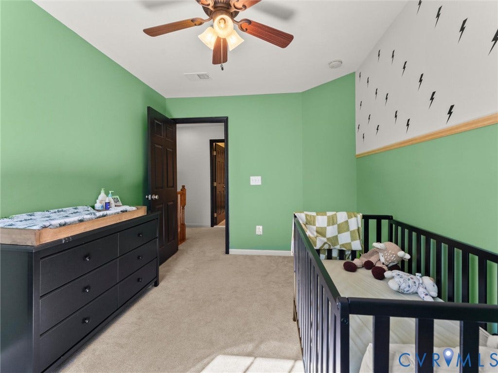 126 Reedy Creek Road, Reedy Creek, Louisa, VA 23093 The property features a room with carpeted floors, a ceiling fan, and a two-toned wall design with a chair rail