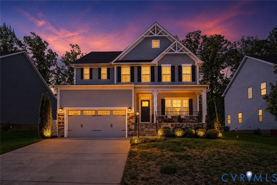 18155 Sagamore Drive, Moseley, VA 23120 Two-story residential exterior featuring gray siding, a stone facade accent, and a covered front porch
