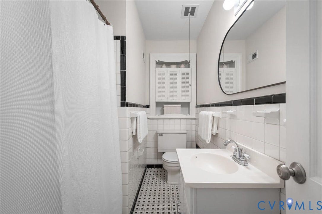 613 Maple Avenue, Near West End, Richmond, VA 23226 White tile walls with black accent trim