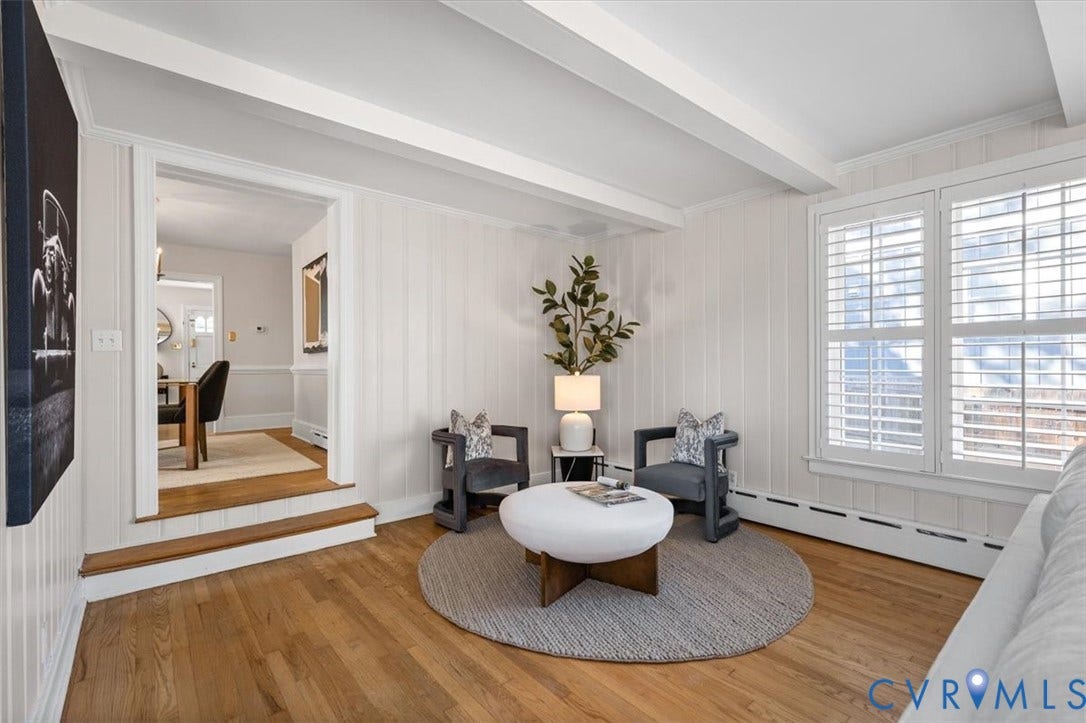 613 Maple Avenue, Near West End, Richmond, VA 23226 Hardwood flooring, painted wood paneling, white ceiling beams, and plantation shutters