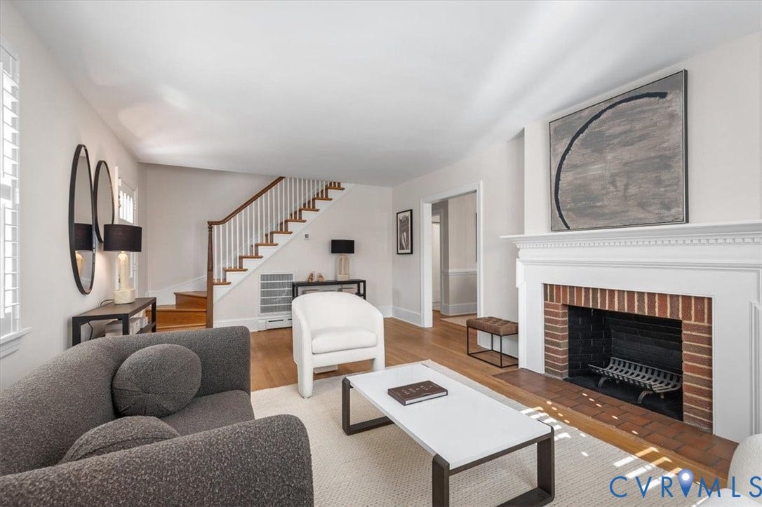 613 Maple Avenue, Near West End, Richmond, VA 23226 Hardwood flooring, brick-surround fireplace with ornate mantel, plantation shutters, and a classic staircase with painted risers and wood treads