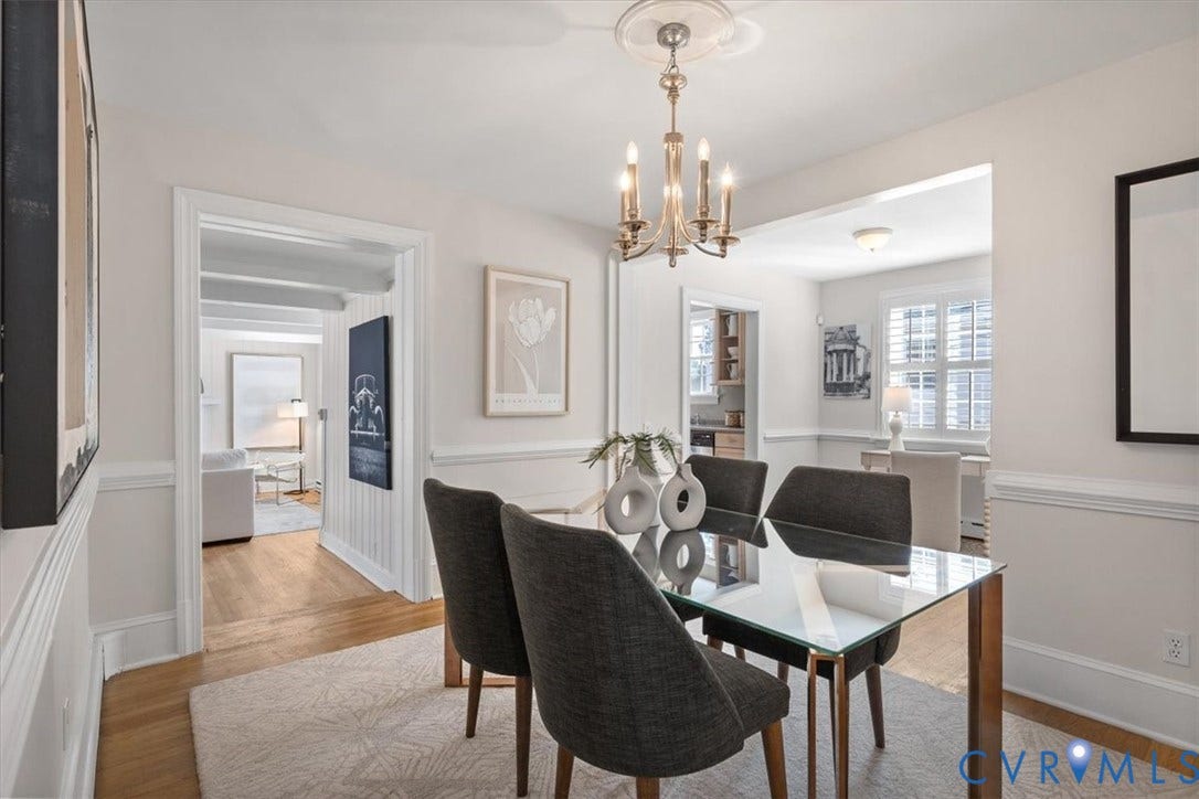 613 Maple Avenue, Near West End, Richmond, VA 23226 Light-toned walls, wood-finish flooring, decorative ceiling medallion, and a chandelier with candelabra-style lighting