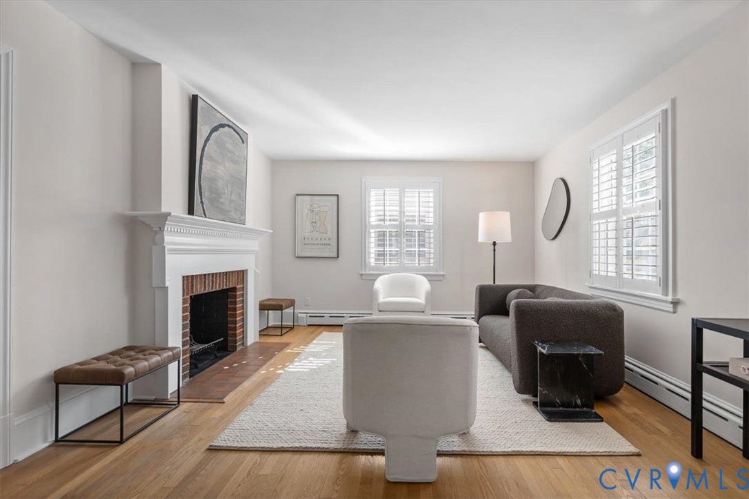 613 Maple Avenue, Near West End, Richmond, VA 23226 Hardwood flooring, white window shutters, classic fireplace with brick surround, crown molding, and light-toned wall finishes