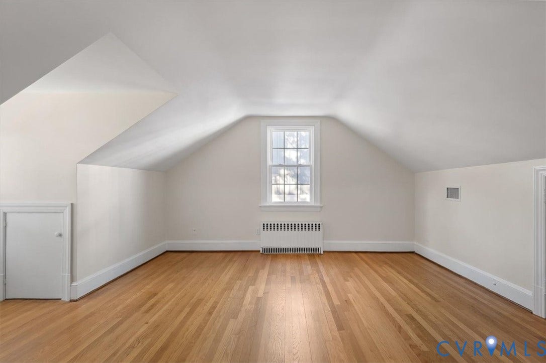 613 Maple Avenue, Near West End, Richmond, VA 23226 Hardwood flooring, painted walls, window with grilles, built-in storage, and a radiator