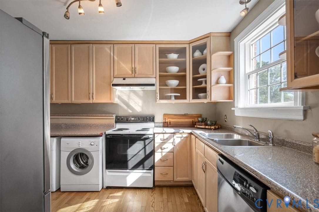 613 Maple Avenue, Near West End, Richmond, VA 23226 Light wood cabinetry, wood-finish flooring, and track lighting