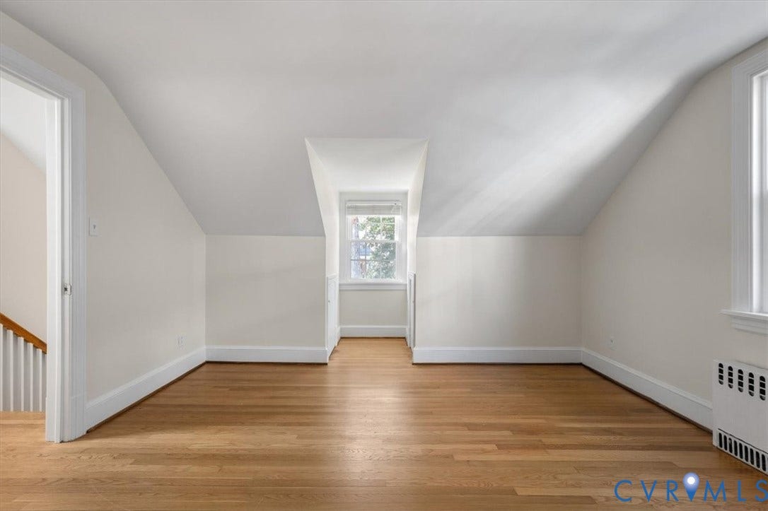 613 Maple Avenue, Near West End, Richmond, VA 23226 Hardwood flooring, painted white walls, white trim, and a dormer window