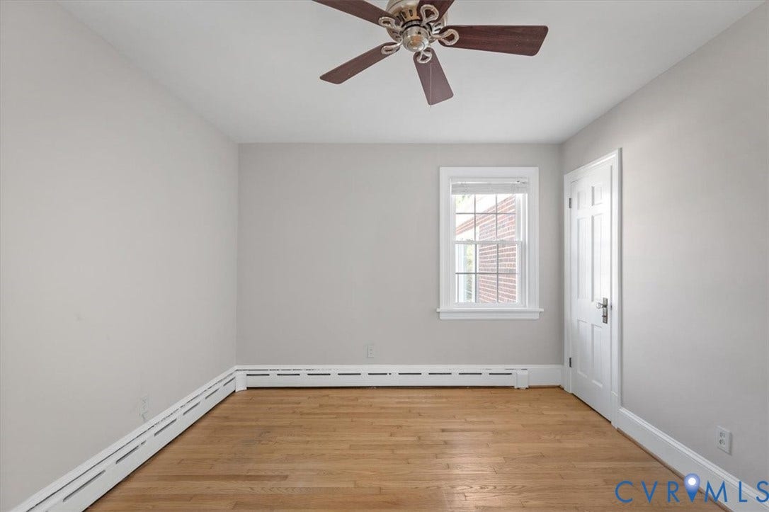 613 Maple Avenue, Near West End, Richmond, VA 23226 Hardwood flooring, painted walls, ceiling fan, white trim, and a paneled door