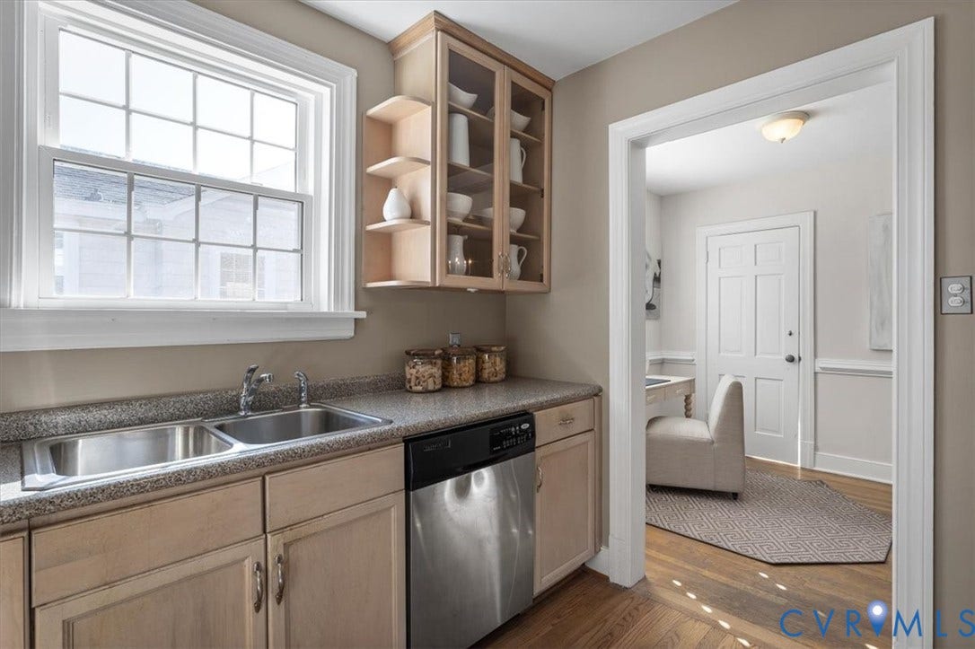613 Maple Avenue, Near West End, Richmond, VA 23226 Kitchen featuring wood-finish cabinetry, stainless steel double basin sink, stainless steel dishwasher, and a window with grid detailing