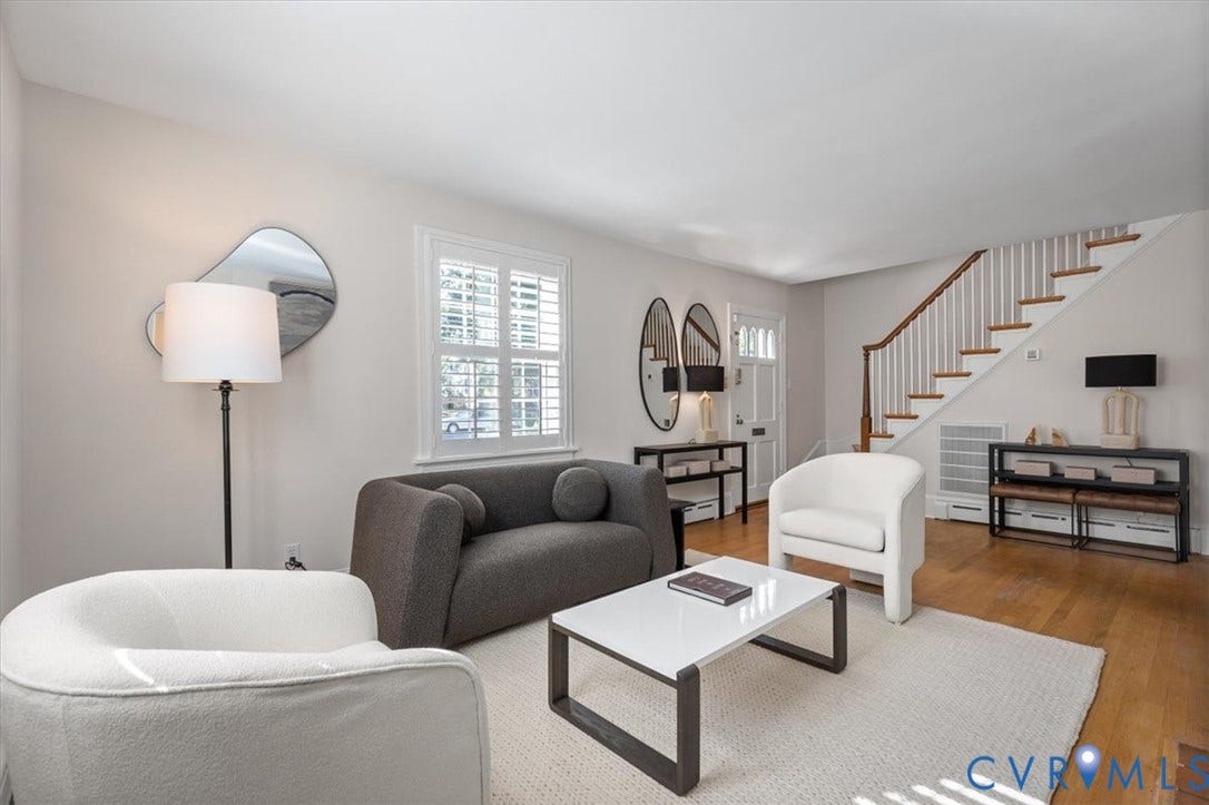 613 Maple Avenue, Near West End, Richmond, VA 23226 Hardwood flooring, painted white walls, white plantation shutters, and a classic staircase with wood treads and white risers