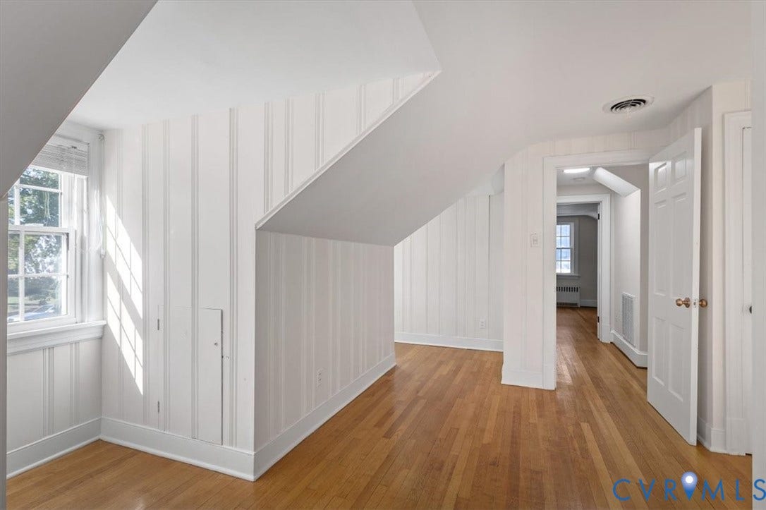 613 Maple Avenue, Near West End, Richmond, VA 23226 Hardwood flooring, painted paneled walls, and a casement window