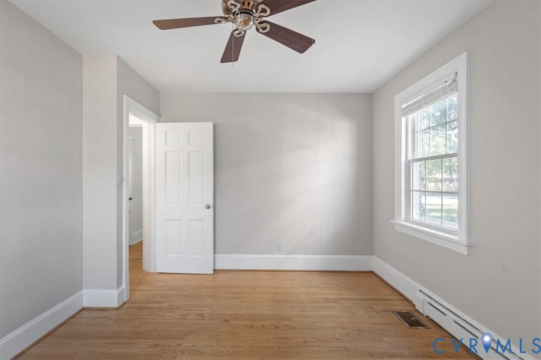 613 Maple Avenue, Near West End, Richmond, VA 23226 Hardwood flooring, ceiling fan fixture, white trim, single window, and painted walls