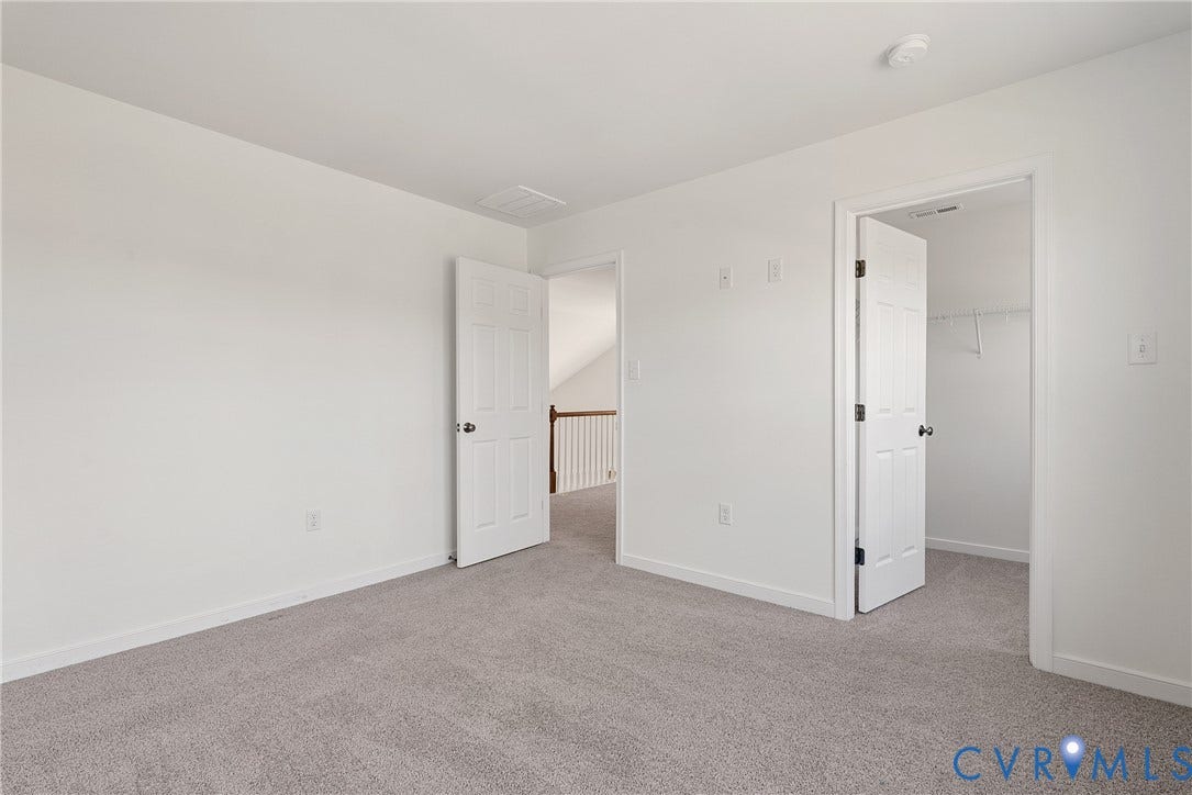 1605 Reed Marsh Place, Reed Marsh, Goodview, VA 23063 Spacious room featuring neutral carpeting and white walls, walk-in closet.