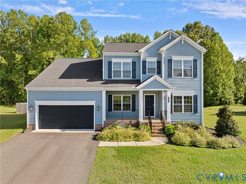 1605 Reed Marsh Place, Reed Marsh, Goodview, VA 23063 Two-story residence featuring light blue siding with white trim and dark blue shutters.