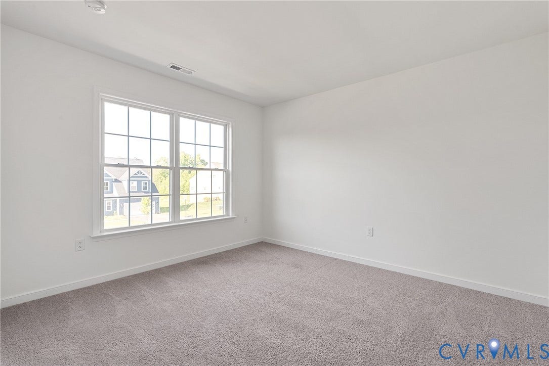 1605 Reed Marsh Place, Reed Marsh, Goodview, VA 23063 Spacious room featuring neutral carpeting and white walls, walk-in closet.
