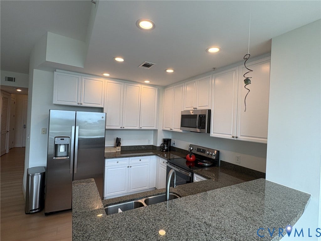 301 Virginia Street, #U804, Downtown, Richmond, VA 23219 Kitchen has recessed lighting, undermount sink, built-in microwave and eat-in counter.