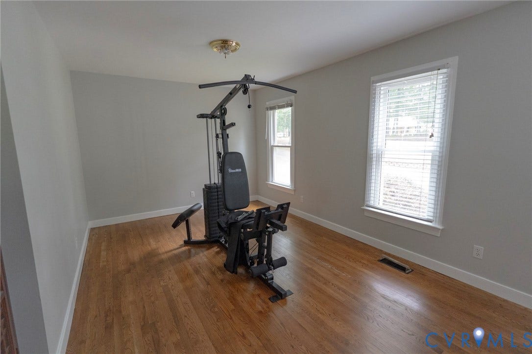 1670 Mill Quarter Road, Powhatan, VA 23139 wood-finish flooring, light gray wall paint, and white trim