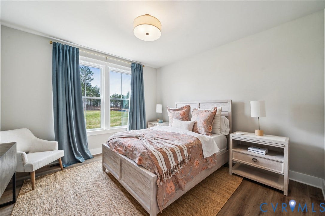 Guest suite on first floor. Photo of model home.