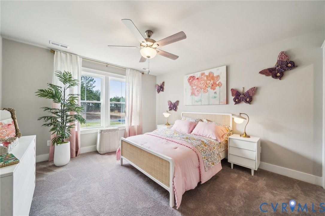 Bedroom 4 with WIC. Photo of model home.