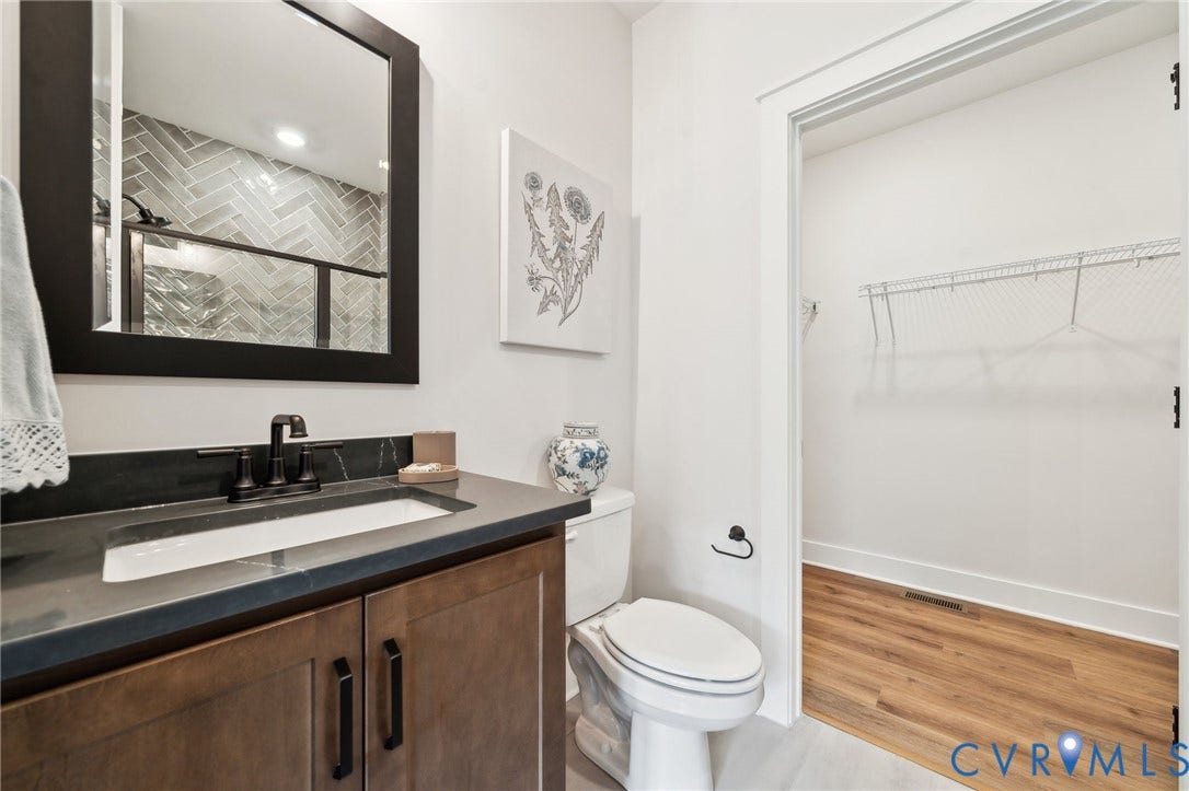 Guest suite on first floor. Photo of model home.