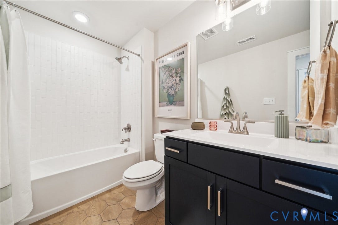 Shared hall bathroom, 2nd floor. Photo of model home.