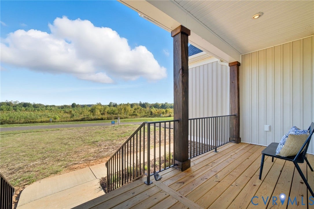 TBD Buckners (Lot 21) Lane, Compass Cove, Mineral, VA 23117 Rea covered back porch. Photo of staged home.
