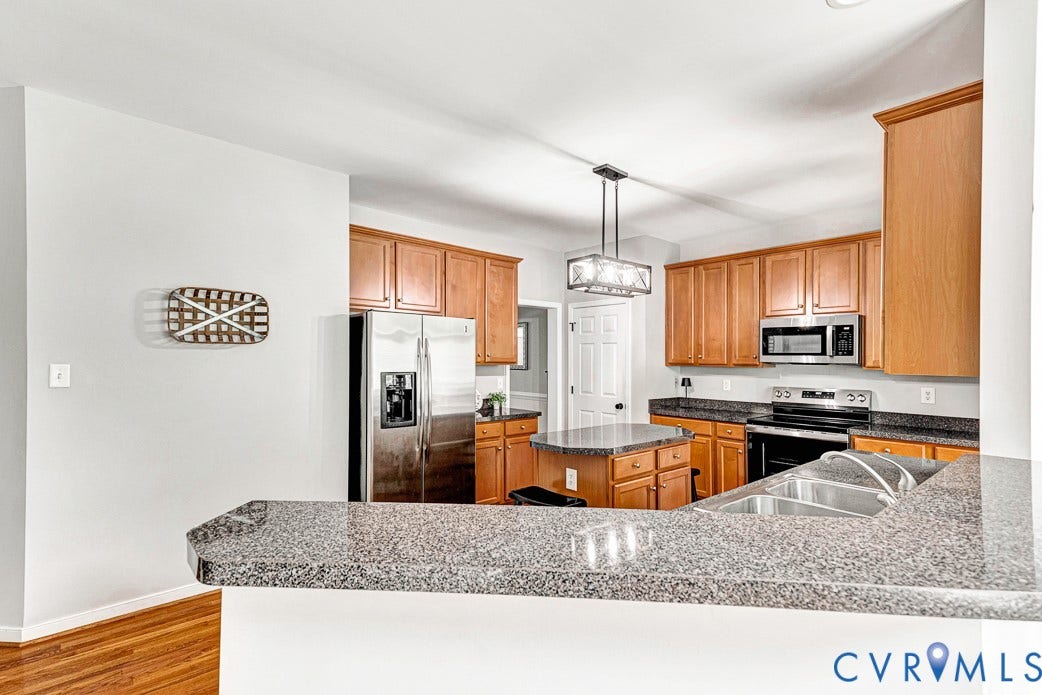 5841 Dorton Lane, Carrington, Glen Allen, VA 23060 Large kitchen with lots of counter space, an island and a pantry.