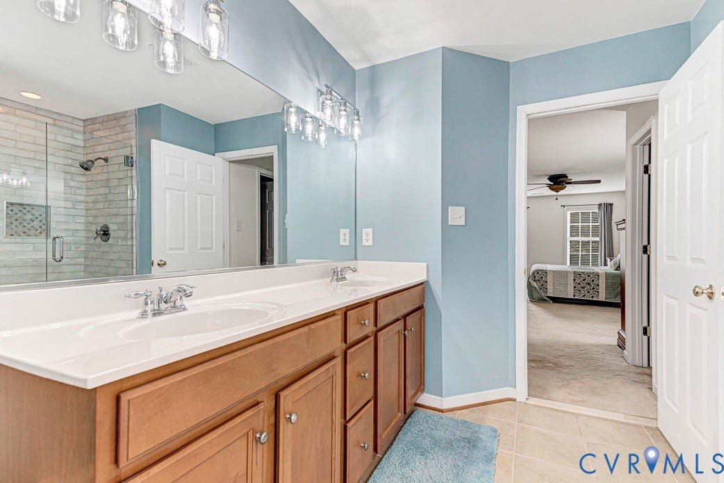 5841 Dorton Lane, Carrington, Glen Allen, VA 23060 Large double vanity and you can see the updated shower in the mirror.