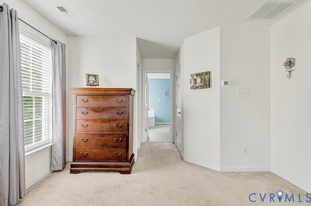 5841 Dorton Lane, Carrington, Glen Allen, VA 23060 The primary bathroom is straight ahead, there are walk-in closets on both sides of the hallway to the bathroom.