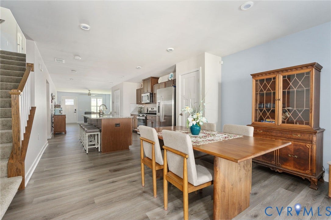 7236 George Wythe Lane, Summer Maple, New Kent, VA 23124 Expansive room featuring wood-finish flooring, a kitchen island with seating, stainless steel appliances, and recessed lighting