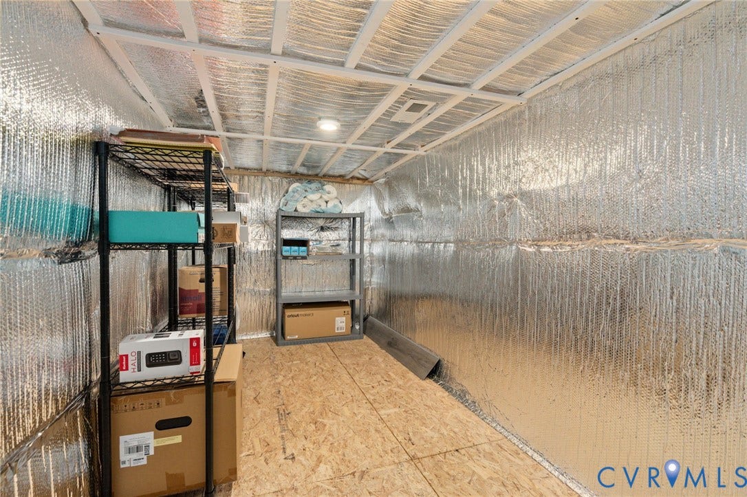 7236 George Wythe Lane, Summer Maple, New Kent, VA 23124 Storage area featuring reflective insulation, oriented strand board flooring, and track lighting