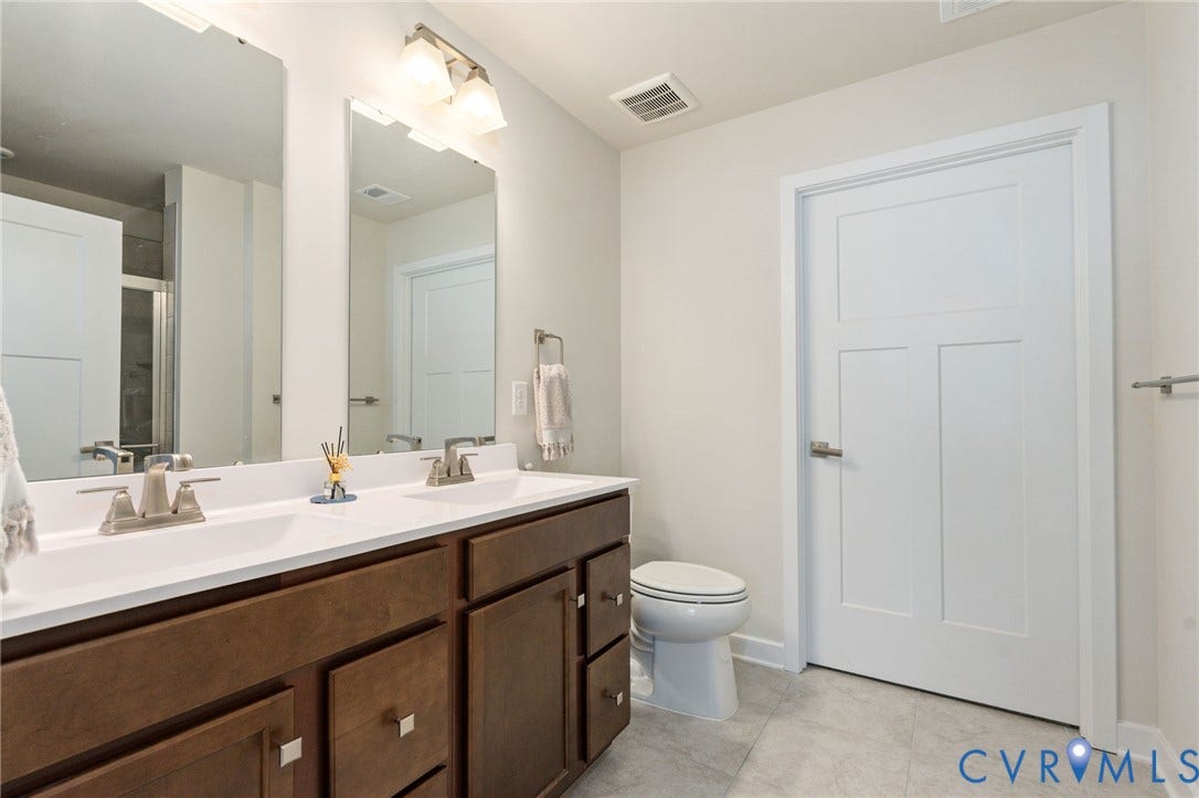 7236 George Wythe Lane, Summer Maple, New Kent, VA 23124 Dual sink vanity featuring a white countertop and wood-finish cabinetry