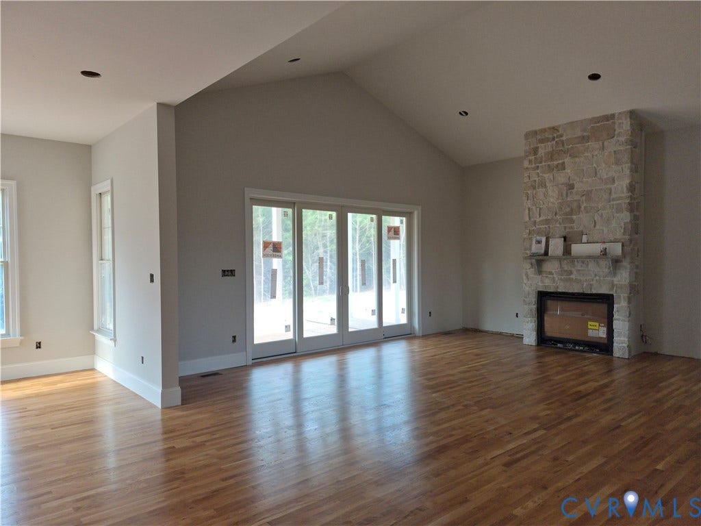 1554 Smokey Ridge Road, Breeze Hill, Maidens, VA 23102 Vaulted living area with stone fireplace.