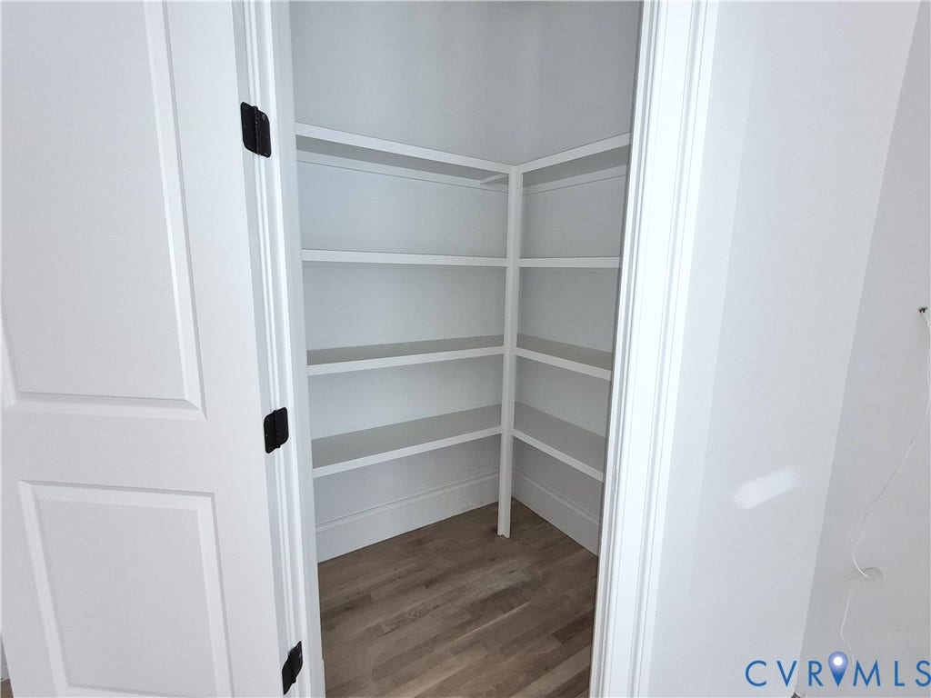 1554 Smokey Ridge Road, Breeze Hill, Maidens, VA 23102 Walk in kitchen pantry, Built-in shelving, wood-finish flooring, and dark hardware