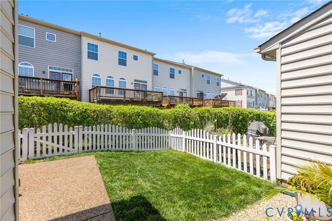 3105 Abruzzo Place, The Villas At Hunton Park, Glen Allen, VA 23059 Fenced in backyard with aggregate patio. HOA manages the yardwork.