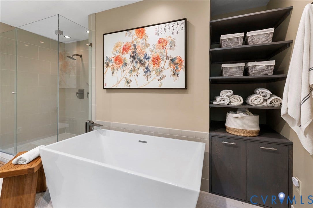 3172 Three Bridge Road, Powhatan, Powhatan, VA 23139 Beautiful soaking tub & built in shelf & cabinet storage in primary bathroom.
