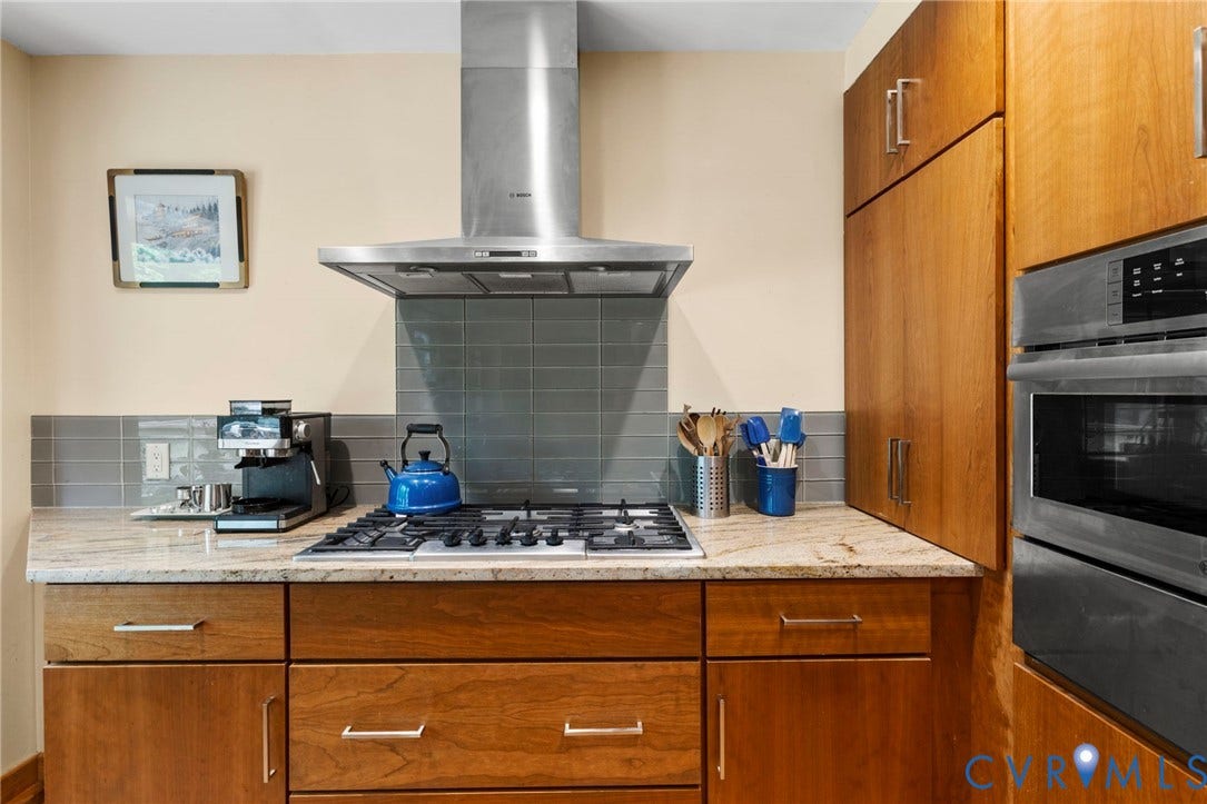3172 Three Bridge Road, Powhatan, Powhatan, VA 23139 Propane gas cooktop with stainless steel range hood.