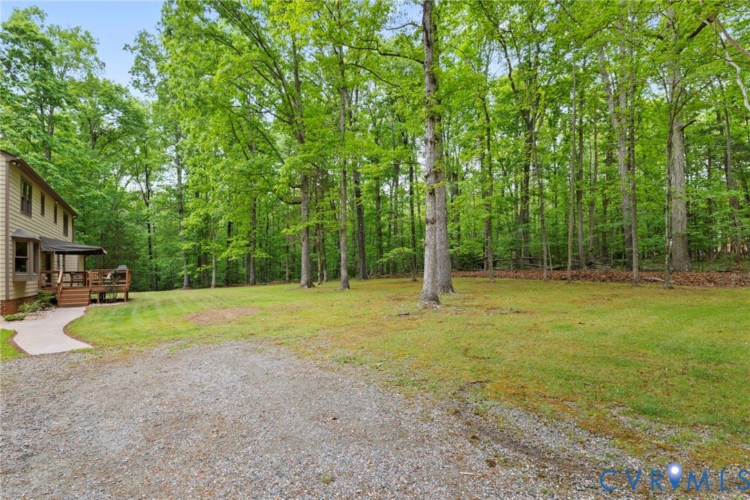3172 Three Bridge Road, Powhatan, Powhatan, VA 23139 Huge yard with plenty of open space and surrounded by mature trees for wonderful privacy and wooded views.