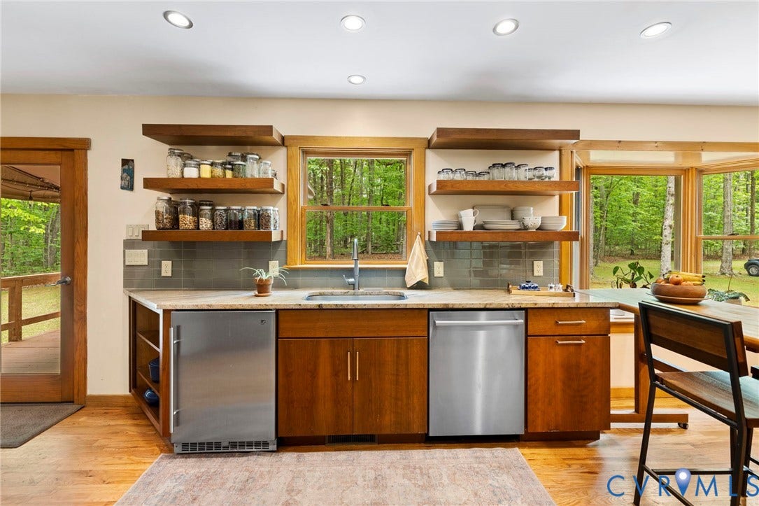 3172 Three Bridge Road, Powhatan, Powhatan, VA 23139 Renovated kitchen in 2016 with tile backsplash, open shelf storage, & granite counters.