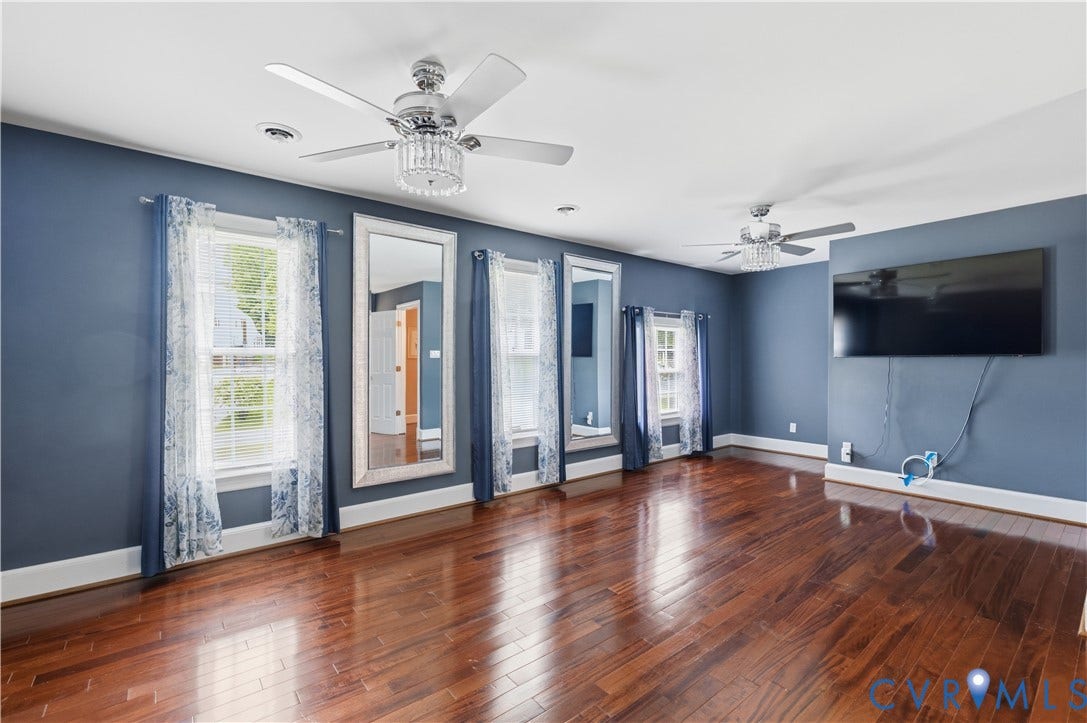 9803 Gates Bluff Drive, Gates Bluff, Chesterfield, VA 23832 Hardwood flooring, painted walls, and white trim characterize this room