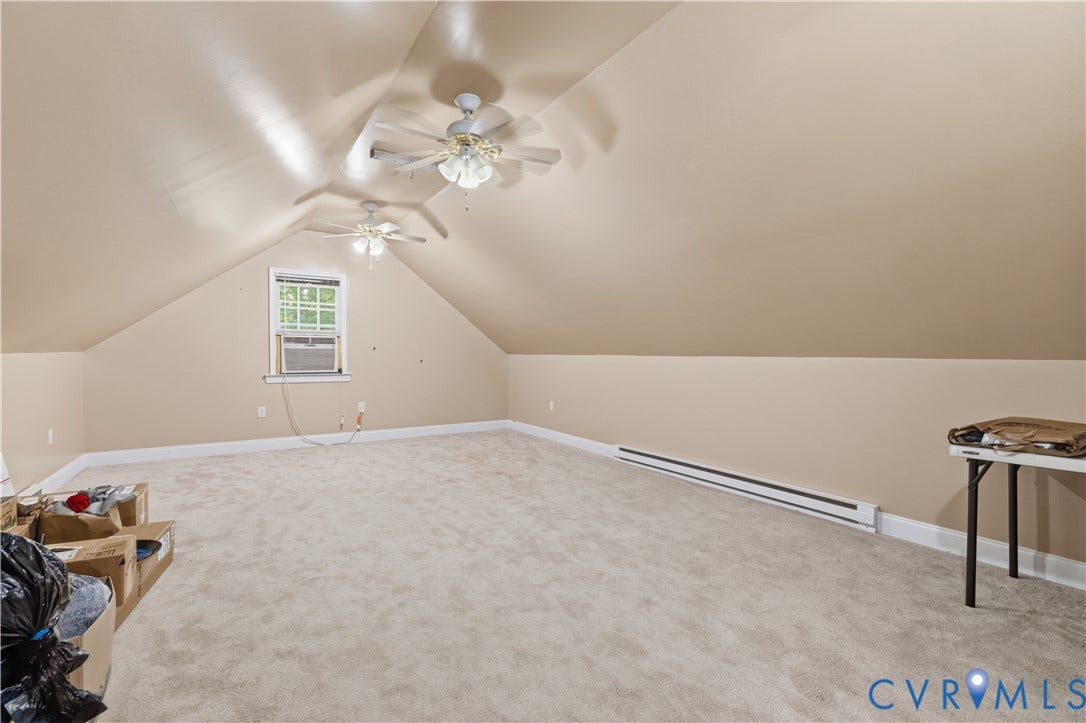 9803 Gates Bluff Drive, Gates Bluff, Chesterfield, VA 23832 Spacious room with sloped ceilings and light beige wall paint