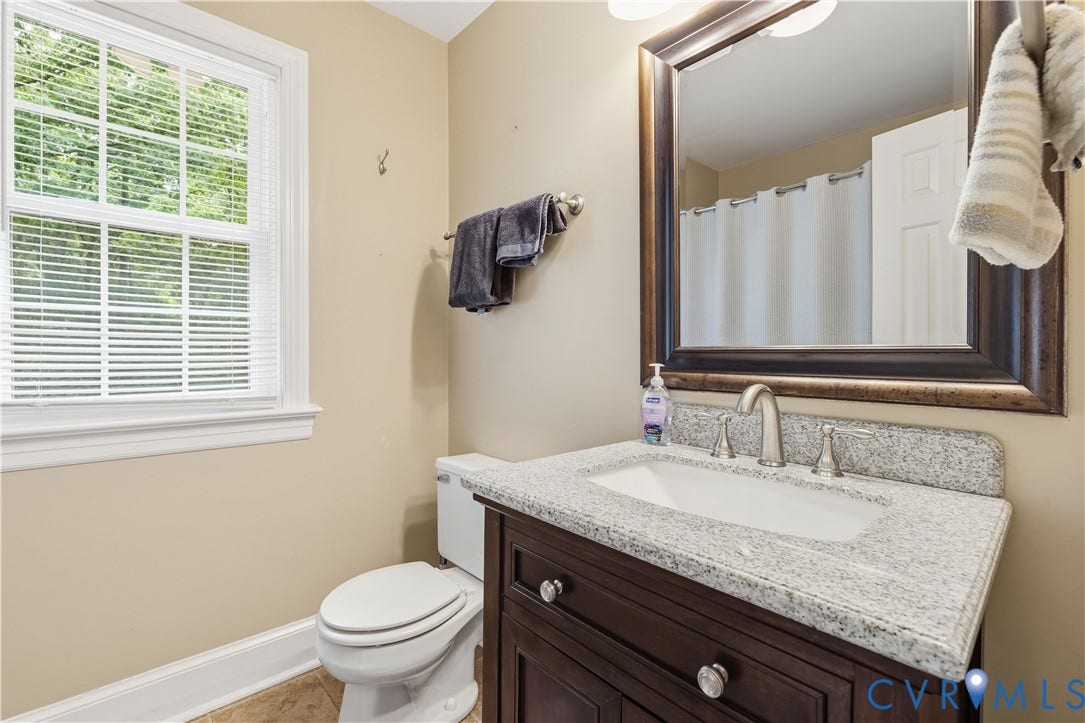 9803 Gates Bluff Drive, Gates Bluff, Chesterfield, VA 23832 Bathroom with a dark wood vanity, white integrated sink, and light speckled countertop