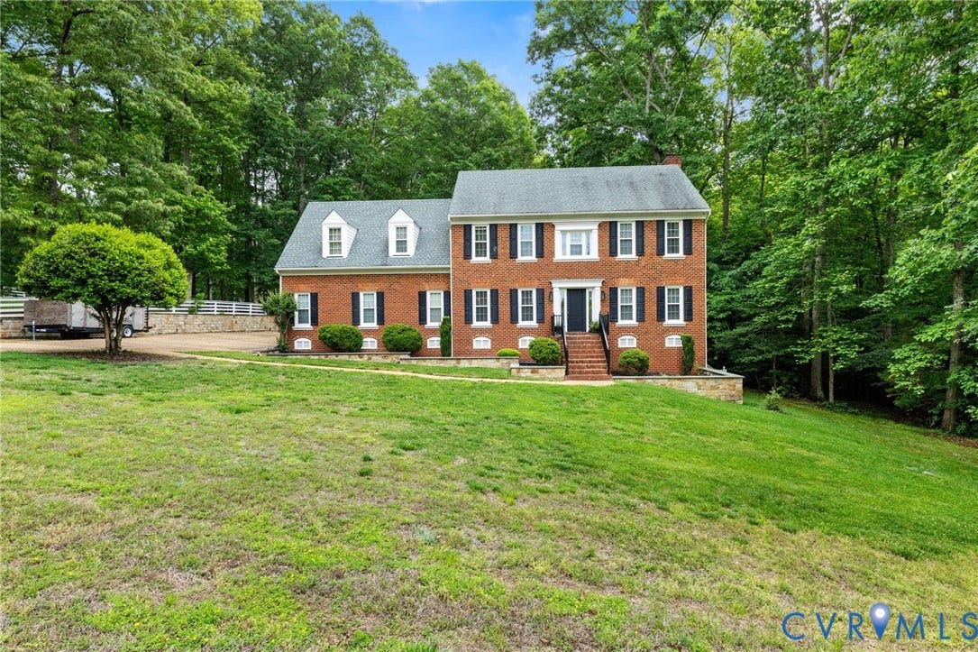 9803 Gates Bluff Drive, Gates Bluff, Chesterfield, VA 23832 Traditional brick two-story residence featuring a prominent front entrance with stone steps