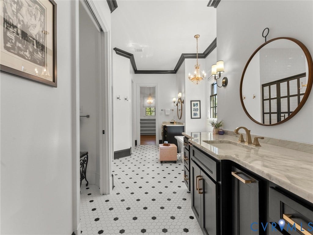 16131 Binley Road, Hallsley, Midlothian, VA 23112 10'3" X 18'10". Two vanities, a private water closet, a luxurious shower, and a soaking tub complete the Primary Bathroom.